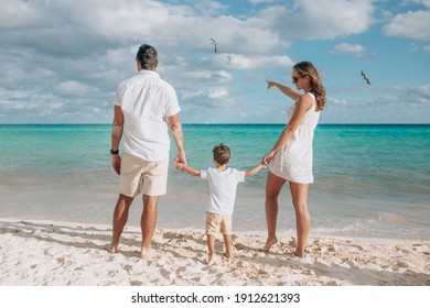 Happy Family On The Beach. Family Vacation