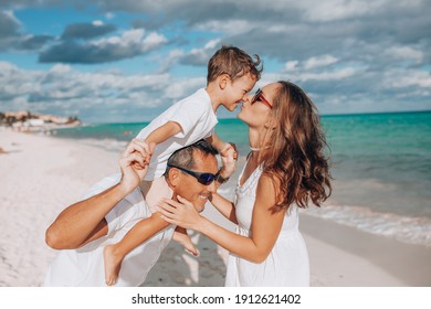 Happy Family On The Beach. Family Vacation