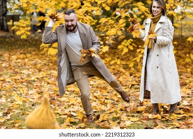 Happy Family On A Beautiful Fall Picnic In The Park. Cozy Autumn Vibes. Young Father, Mother And Their Cute Sn Spending Quality Time Together, Having Fun.