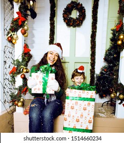 Happy Family On Christmas In Red Hats Waiting Guests And Smiling Outdoors