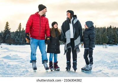 A Happy Family On Ice Skating On Winter Season Lake