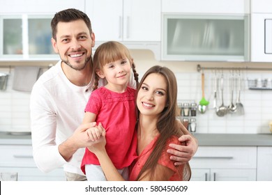 Happy Family On Kitchen At Home