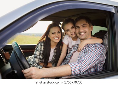 Happy Family On The Road In A Car On An Adventure Vacation Trip.