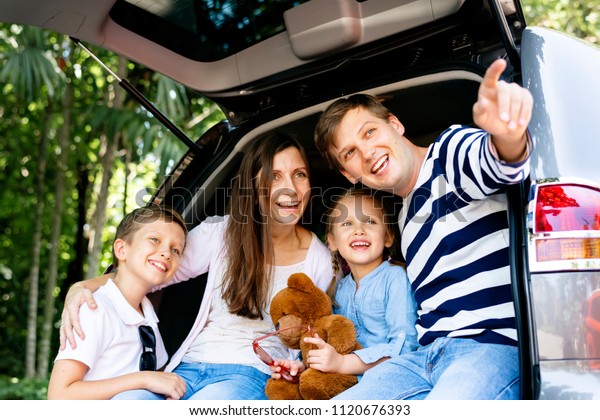 Happy family on a road\
trip