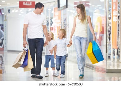 A Happy Family On Shopping In The Store