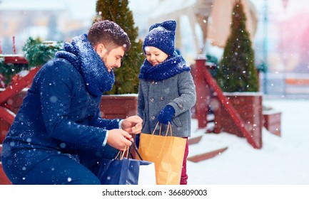 Happy Family On Shopping In Winter City