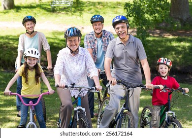 Happy family on their bike at the park on a sunny day