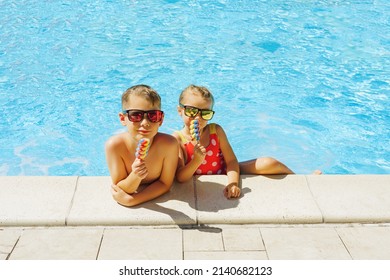 Happy family on vacation eating ice cream at swimming pool - Powered by Shutterstock