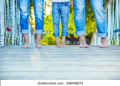 Happy Family On A Walk In Summer. Child With Parents Together. Feet Barefoot . Healthy Lifestyle. Dad Mom And Son. Spring Time.