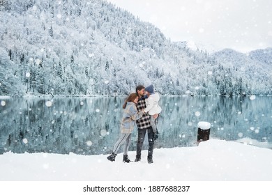 Happy Family On The Winter Snow Lake