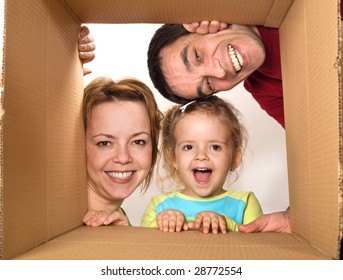 Happy Family Opening Cardboard Box - Moving Concept