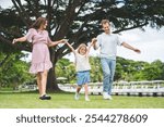 Happy family parent children having picnic outdoor activity. Enjoy happiness moment summer playing together including father mother son and daughter relaxing in the morning sunrise.