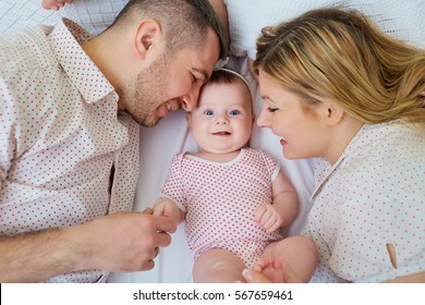 Happy Family Parents Baby On Bed Stock Photo Edit Now