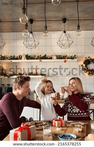 Similar – Image, Stock Photo Gingerbread girl cookie and little boy cookie. Christmas concept