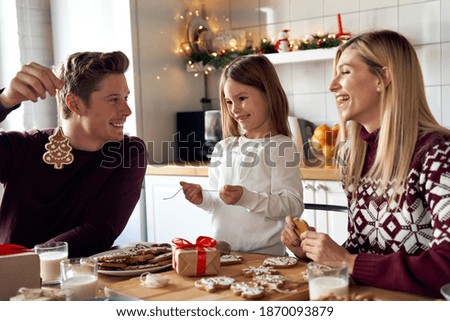 Similar – Image, Stock Photo Gingerbread girl cookie and little boy cookie. Christmas concept