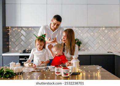 Happy family parents with two kids and golden retriever puppy making xmas cookies at home during winter holidays. Mother, father and little children behind kitchen table cooking at Christmas time - Powered by Shutterstock