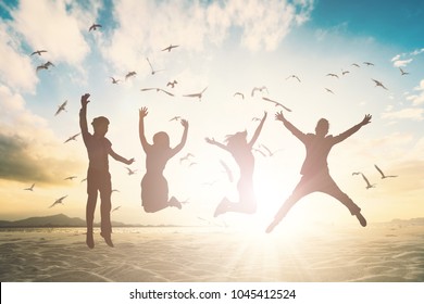 Happy Family Person Group Jump On Fly Bird Beach Background Concept For Good Of Togerther Team Mlm Retreat, Wealthy Life Insurance. Students People Feel Good Celebration For Victory Holiday Hours.