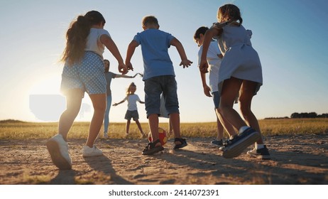 happy family playing ball in the park. group of children playing ball in nature. happy family kid dream concept. children playing lifestyle soccer in the sunset park in nature - Powered by Shutterstock