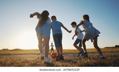 happy family playing ball in the park. group of children playing ball in nature. happy family kid dream concept. children playing lifestyle sunset soccer in the park in nature - Powered by Shutterstock