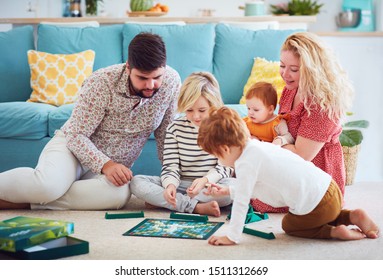 Happy Family Playing Board Games Together At Home