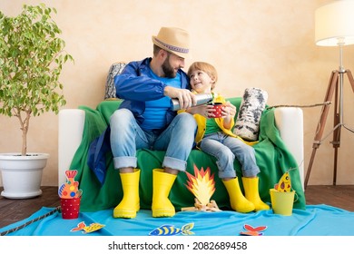 Happy Family Playing. Dad And Son Enjoying A Fishing Trip. Father And Child Having Fun. Man And Kid At Home. Summer Vacation Concept