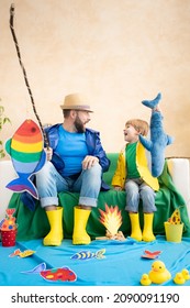 Happy Family Playing. Dad And Son Enjoying A Fishing Trip. Father And Child Having Fun. Man And Kid At Home. Summer Vacation Concept