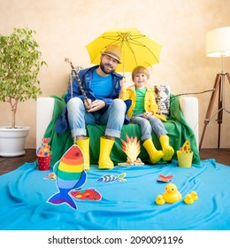 Happy Family Playing. Dad And Son Enjoying A Fishing Trip. Father And Child Having Fun. Man And Kid At Home. Summer Vacation Concept