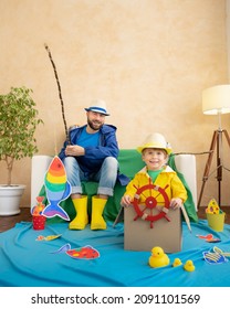 Happy Family Playing. Dad And Son Enjoying A Fishing Trip. Father And Child Having Fun. Man And Kid At Home. Summer Vacation Concept