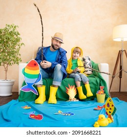 Happy Family Playing. Dad And Son Enjoying A Fishing Trip. Father And Child Having Fun. Man And Kid At Home. Summer Vacation Concept