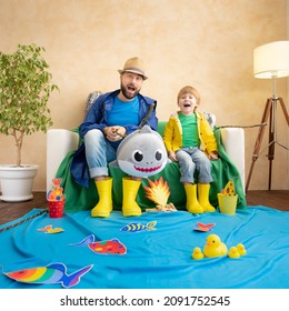 Happy Family Playing. Dad And Son Enjoying A Fishing Trip. Father And Child Having Fun. Man And Kid At Home. Summer Vacation Concept