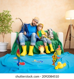 Happy Family Playing. Dad And Son Enjoying A Fishing Trip. Father And Child Having Fun. Man And Kid At Home. Summer Vacation Concept