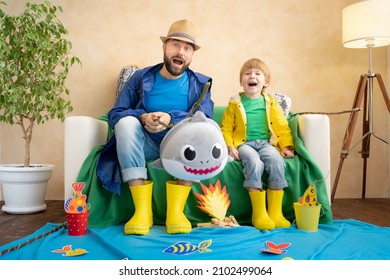 Happy Family Playing. Dad And Son Enjoying A Fishing Trip. Father And Child Having Fun. Man And Kid At Home. Summer Vacation And Fathers Day Concept