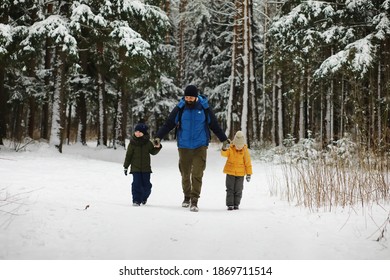 Happy family playing and laughing in winter outdoors in snow. City park winter day. - Shutterstock ID 1869711514