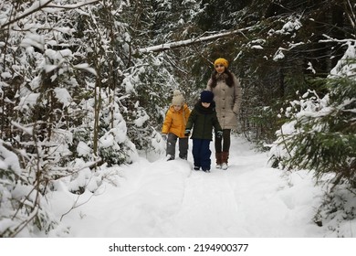 Happy family playing and laughing in winter outdoors in snow. City park winter day. - Shutterstock ID 2194900377