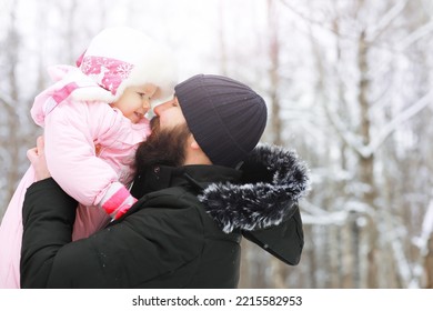 Happy Family Playing And Laughing In Winter Outdoors In Snow. City Park Winter Day.