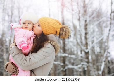 Happy Family Playing And Laughing In Winter Outdoors In Snow. City Park Winter Day.