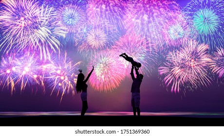 Happy Family Playing On The Beach And Watching The Fireworks