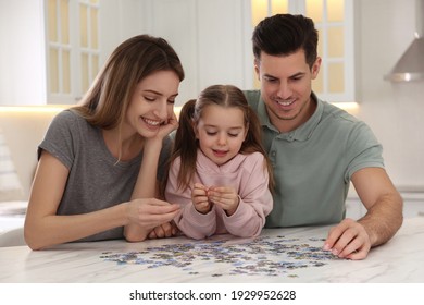 Happy Family Playing With Puzzles At Home