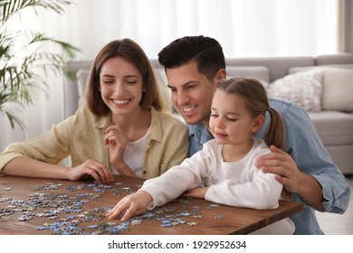 Happy Family Playing With Puzzles At Home