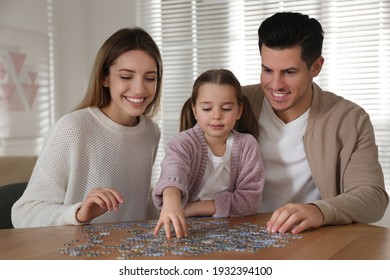 Happy Family Playing With Puzzles At Home