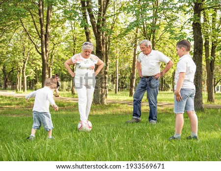 Similar – junge wirft einen Ball auf die Oma