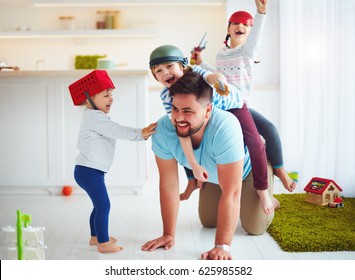 happy family playing together at home, riding on father