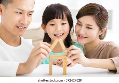 Happy Family Playing With Toy Blocks