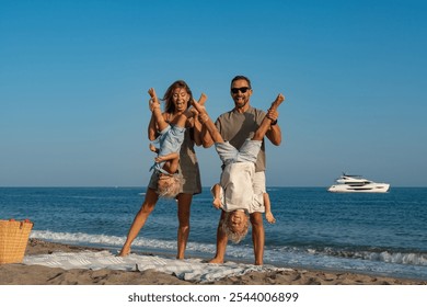 Happy Family Playing Upside Down on the Beach - Powered by Shutterstock