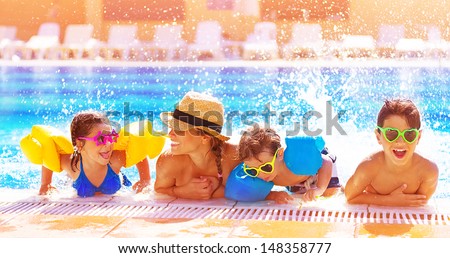 Similar – Image, Stock Photo Mother enjoying summer vacations holding, playing and lifting his infant baby boy son high in the air on sandy beach on Lanzarote island, Spain. Family travel and vacations concept
