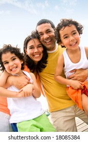 Happy Family Portrait Outdoors During A Holiday - Togetherness Concept