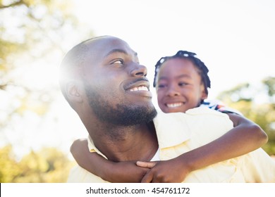 Happy Family Posing Together At Park