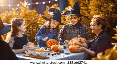 Happy family preparing for Halloween. Mother, grandmother and children carving pumpkins in the backyard of the house.