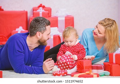 Happy Family With Present Box. Valentines Day. Red Boxes. Shopping. Boxing Day. Love And Trust In Family. Bearded Man And Woman With Little Girl. Father, Mother And Doughter Child. Family Values.