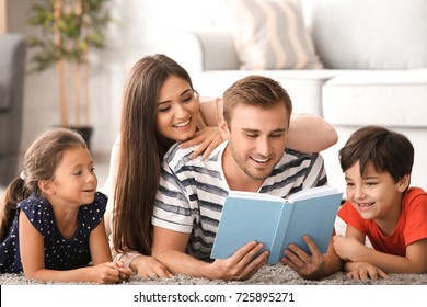 Happy Family Reading Book At Home